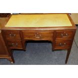 An early 20th century mahogany bow front writing desk,