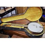 A Saga five string banjo,