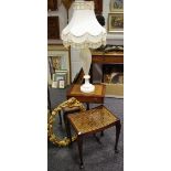 A substantial alabaster lamp base; reproduction tooled leather inlaid occasional table;