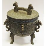 An Indonesian style novelty ice bucket and cover, serpent handles,