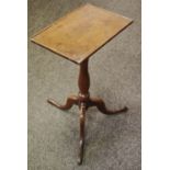 A George III oak lamp table, rectangular top, turned column, three cabriole legs.