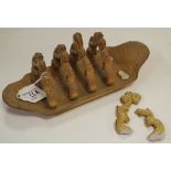 A Brampton Derbyshire brown salt glazed stoneware five bar toast rack, scroll divisions,