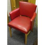 A retro red leatherette club chair.