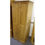 A modern pine two door wardrobe, 175cm high x 73.