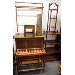 An oak three tier cake stand; an early 20th century towel rail; an oak blanket box,