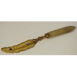 A late 19th/early 20th century gilt metal novelty book mark in the form of a quill,