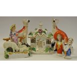 A pair of Victorian of Staffordshire seated greyhounds pen holders;