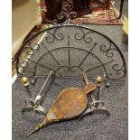 A wrought iron domed fire guard; a pair of fire dogs;