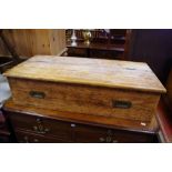 A pine box, 2/3rd hinged top, brass campaign handles. 23cm high x 91.5cm wide x 44cm deep.