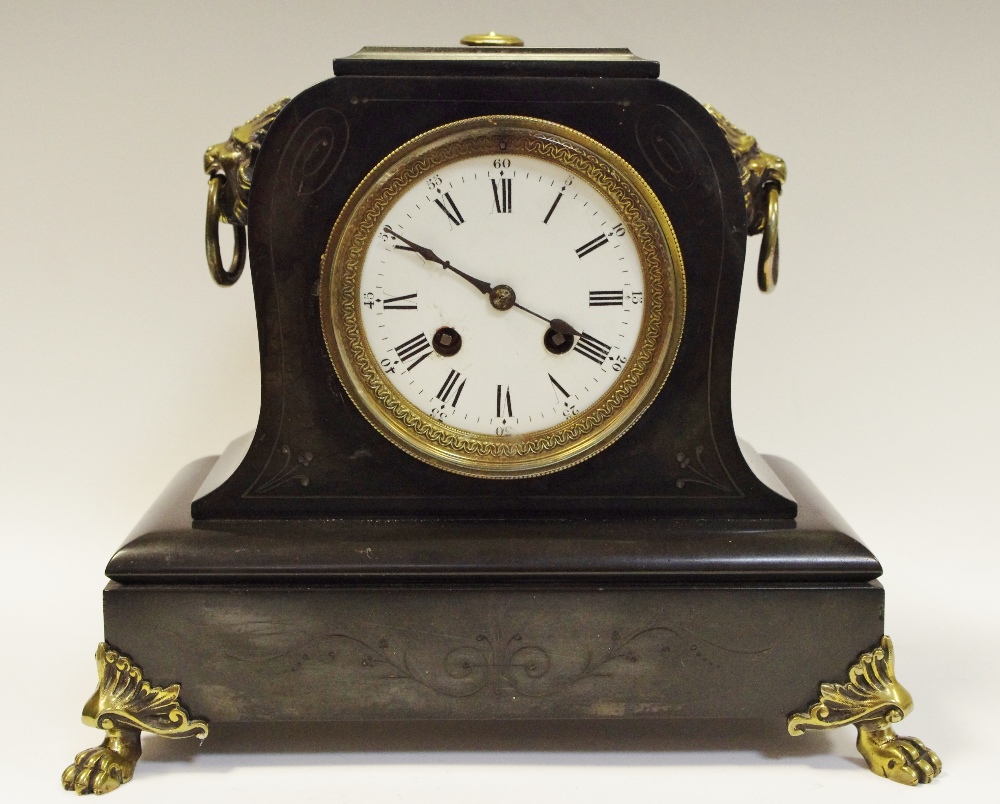 A 19th century French Belge Noir mantle clock, lion mask details c.