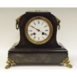 A 19th century French Belge Noir mantle clock, lion mask details c.