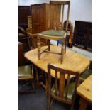 An early 20th century oak gateleg dining table;