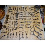 An interesting collection of 18th & 19th century iron keys and 19th century brass padlocks mounted