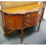 A reproduction serpentine sideboard, three drawers flanked by cupboards, tapering square legs,