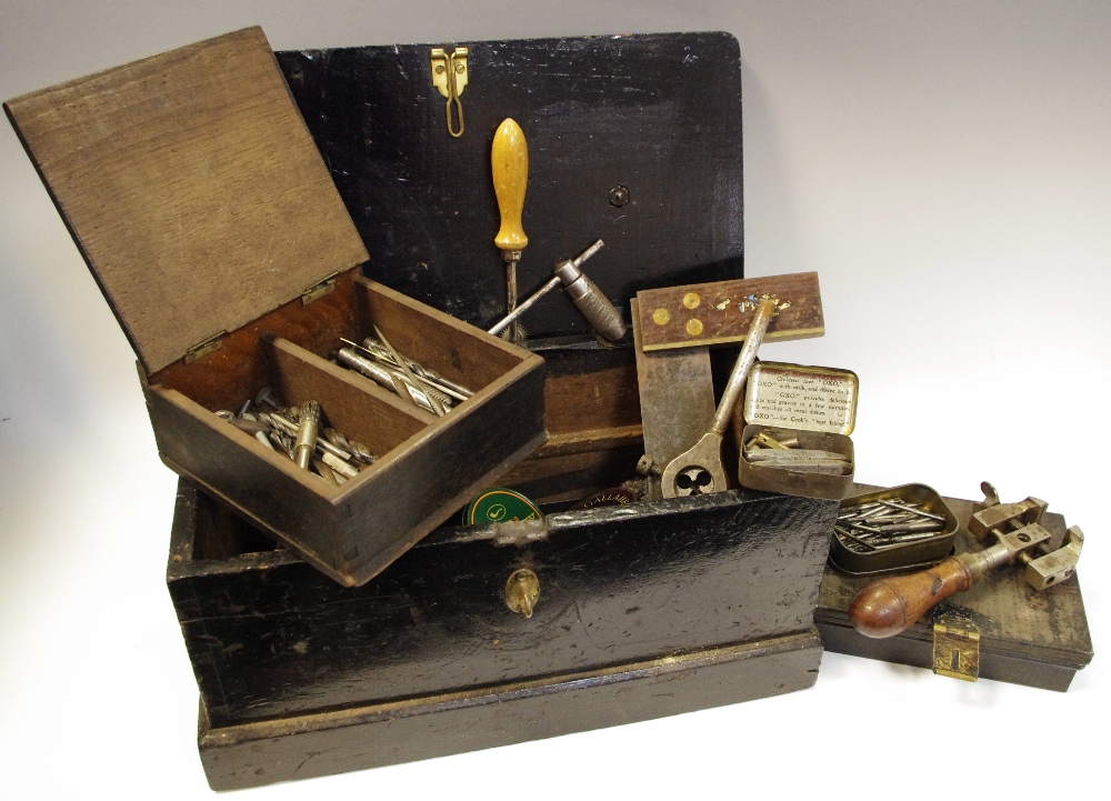 Tools - a small early 20th century tool ebonised toolbox holding early tins with drill bits, screws,