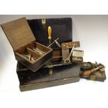 Tools - a small early 20th century tool ebonised toolbox holding early tins with drill bits, screws,