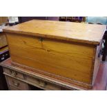 A pitch pine chest, hinged lid, metal handles.