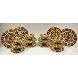 A Royal Crown Derby 1128 pattern part tea setting for 8 comprising tea cups, saucers,