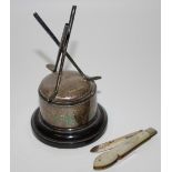 A silver golf trophy raised on ebony plinth base;