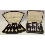 A cased set of six silver teaspoons inscribed with various dates;