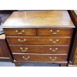 A George III oak chest, moulded top, two short drawers over three graduated long,