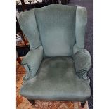 A wingback reading chair,