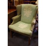 A Barrett & Bolton wing back armchair.