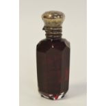 A 19th century silver mounted ruby glass scent bottle, hinged cover enclosing a stopper, c.