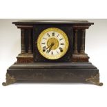 A Victorian ebonised softwood mantle clock with faux marble trim,