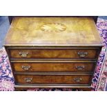 A reproduction low chest of three long burr walnut and mahogany cross banded drawers, bracket feet,
