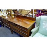 An Edwardian mahogany dressing chest, oval mirror, two short drawers over two long,