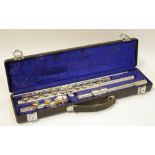 A Boosey & Hawkes, London 'Emperor' silver plated flute, cased; a music stand.