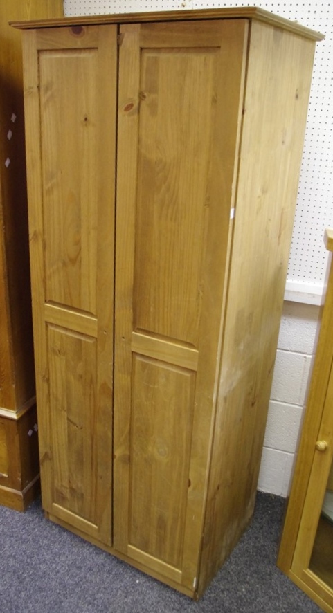 A modern pine two door wardrobe, 175cm high x 73.