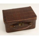 An early to mid-20th century crocodile skin vanity case,