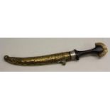 A Middle Eastern kindjahl dagger, 23cm curved blade, hardwood grip,
