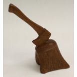 An oak desk novelty, well carved as a woodsman's axe in a tree stump,