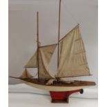 A large early 20th century pond yacht, The Dolphin, red-line to livery, 117cm long,