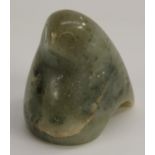 An Inuit jade carving, of a highly stylised bird,