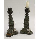 A pair of post-Regency bronze triform candlesticks, cast in relief with shells,