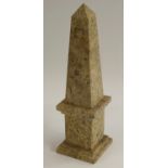 A fossil stone library obelisk, cut and polished to show paleontological specimens, square base,