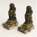A pair of 19th century parcel-gilt and dark patinated bronze library bookends,
