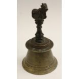 A 19th century Indian bronze temple bell, the handle cast with a cow, 19.