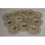 A set of twelve 19th century silk and crochet roundels,