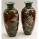 A pair of Japanese cloisonne vases, decorated in polychrome with birds,