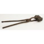 A 19th century bronze pincer-form bullet mould, with ten casting reservoirs,