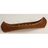 A Native American birch bark model canoe, of stitched construction, 35cm long, Ojibwe People,