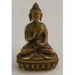 A Chinese bronze Buddha, seated in a lotus, 10cm high,