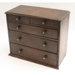 Miniature Furniture - a Victorian vernacular oak table-top chest,