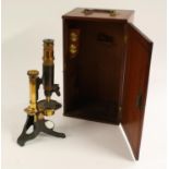 A 19th century lacquered and patinated brass monocular microscope, by E Saunders, High Street,