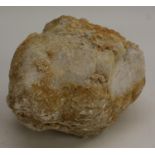 Geology - a bisected white quartz geode, cut to display matrix,